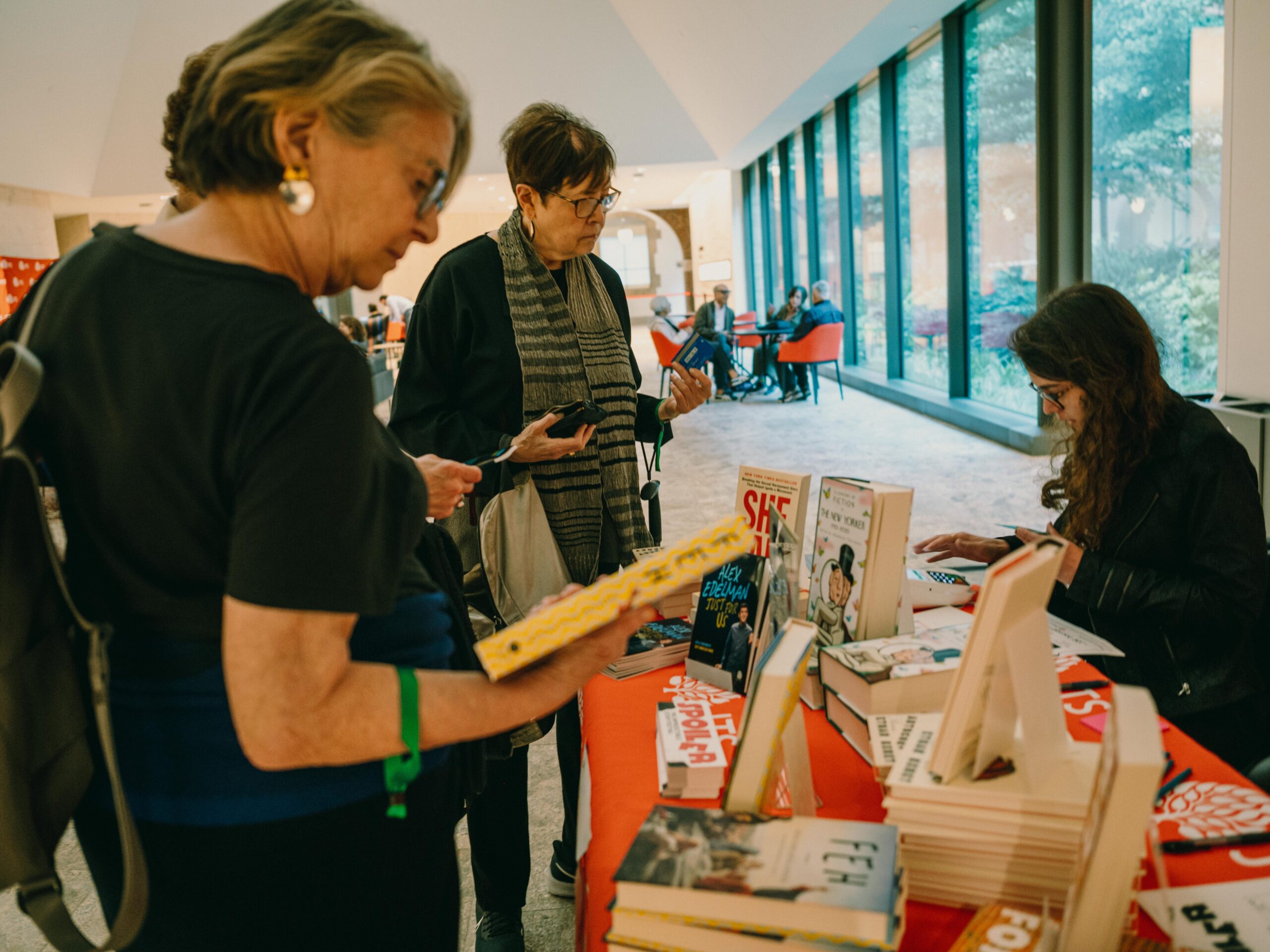 Attendees at SPOILER browse books for purchase by authors