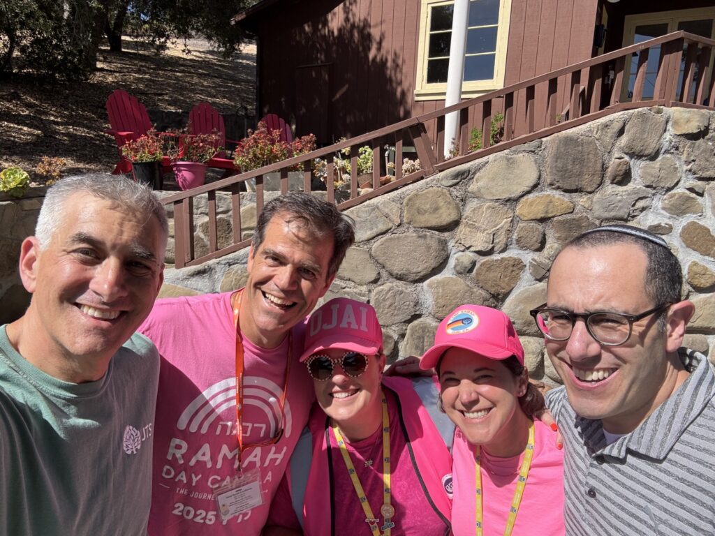 Chancellor Mike Uram, Randy Michaels, and others at camp